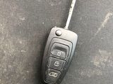 a car key on the seat of a vehicle