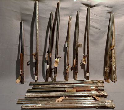 many different types of weapons displayed on the wall