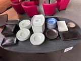 a table with plates and bowls on it in a restaurant