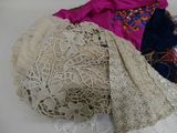 a pile of clothing that is on a table