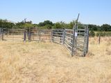 a fence that is in the middle of a field