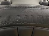 a close up of a black leather bag with the name cassainn on it