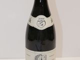a bottle of wine that is sitting on a table