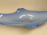 a blue bowl that is sitting on a table