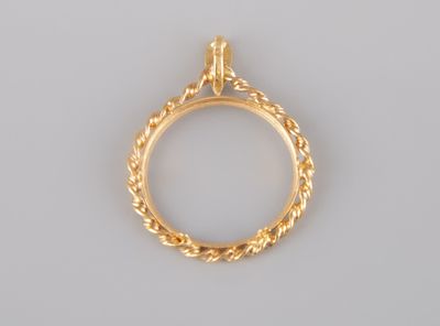 a close up of a gold ring on a white background