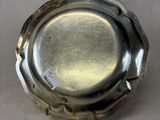 a silver plate that is sitting on a table