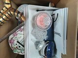 a box that has a bottle of perfume inside of it