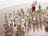 a lot of figurines that are sitting on a table