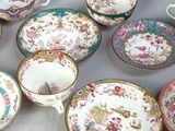 many plates and cups that are sitting on a table