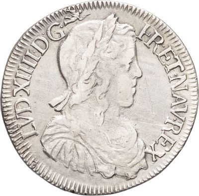 une pièce d'argent portant une tête de femme