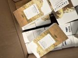 a cardboard box full of boxes of cigarettes and cigarettes