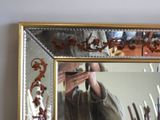 a man taking a picture of himself in a mirror