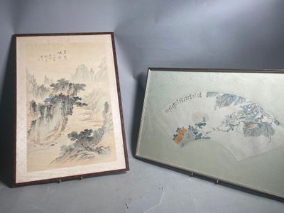two framed asian paintings of mountains and trees on a blue background