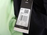 a label on the back of a jacket with a barcode on it
