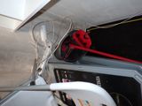 a white chair sitting next to a fan on a counter