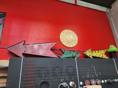 a red wall with a bunch of different signs on it