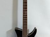 an electric guitar sitting on top of a white surface