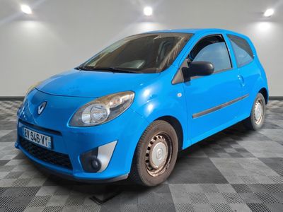 the small blue car is parked in the room on the checkered floor