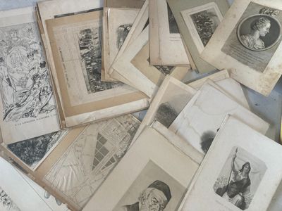 a pile of old books with pictures of people on them