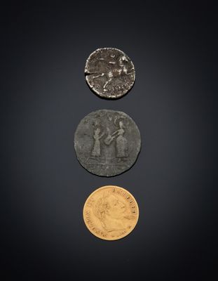 three different types of coins on a black background
