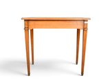 a small wooden table with a drawer underneath it