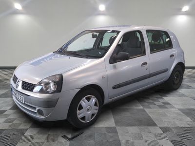 a picture of a small silver car parked in a garage