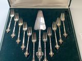 a box with a set of forks and spoons in it