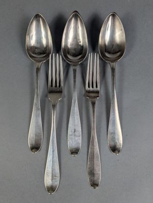 four spoons and a fork are arranged in a row