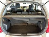 the back of a car with its trunk open and the seats down