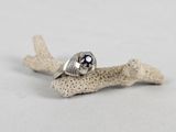 a close up of a silver ring with a blue stone in it