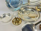 a lot of silver and glass items on the table