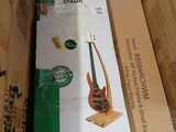 a box with a guitar in it sitting on the floor