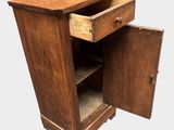 a small wooden cabinet with a drawer inside of it