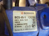 a close up of a blue machine with a label on it