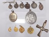 a lot of silver and gold religious items in a display case