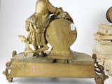 a statue of a man riding a horse on top of a table