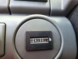 a close up of a button on a car ' s dashboard