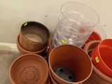 many pots that are sitting on a pallet