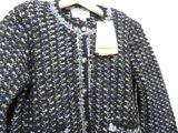 the jacket is blue and white with a black and white pattern