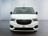 the front view of a white van parked in a room