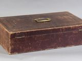 a brown box that has a handle on it