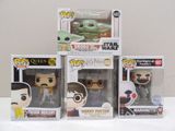 Trois figurines Pop Vinyl représentant l'Enfant Yoda, l'Enfant Yoda et l'Enfant Yoda sont
