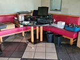 a table with a laptop on it in a restaurant