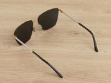 a close up of a pair of sunglasses on a wooden surface