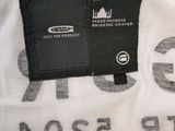 a white t - shirt with a black tag on it