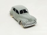 a toy car that is sitting on a white surface