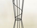a coat rack with five pairs of scissors on it