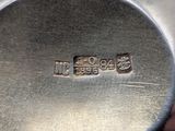 a close up of a metal object with a logo on it