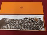 an orange box containing a pair of socks and a pair of gloves
