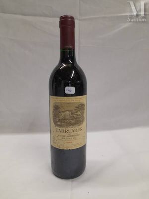 a bottle of wine that is sitting on a table